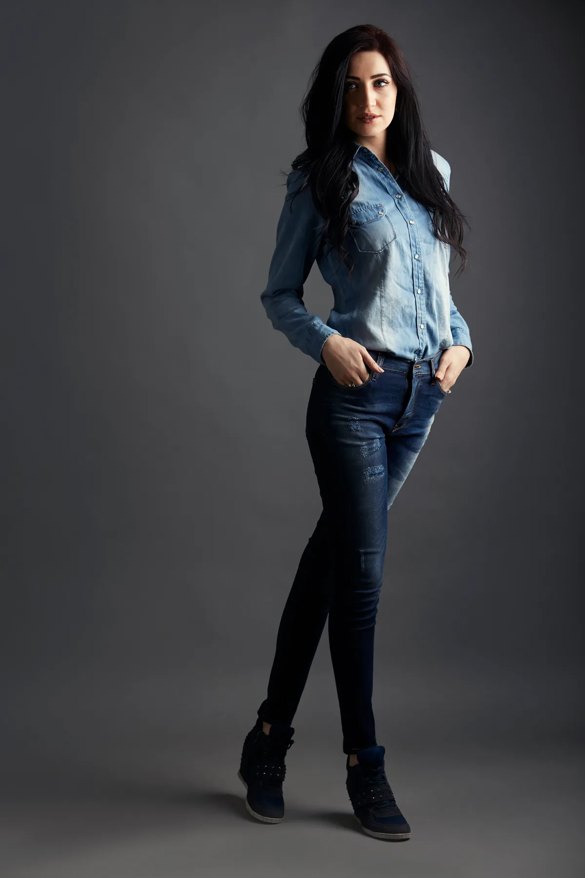 Model in denim shirt and jeans showing Rantex fashion range