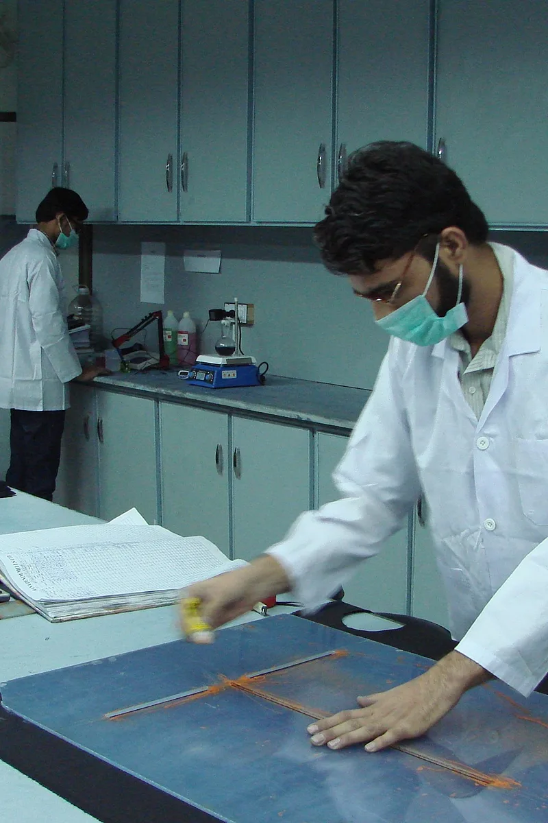 Lab technician testing denim in the fabric laboratory
