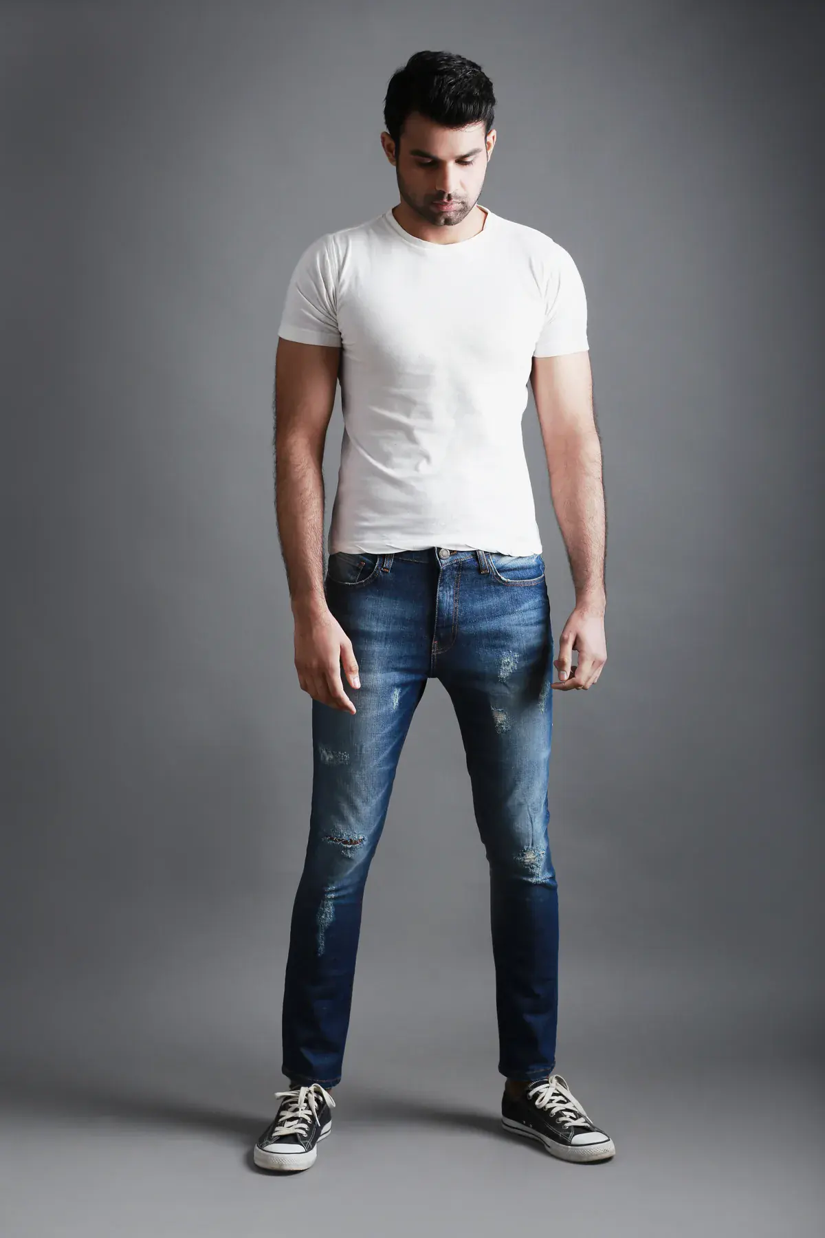 Model wearing Rantex slim-fit distressed indigo jeans