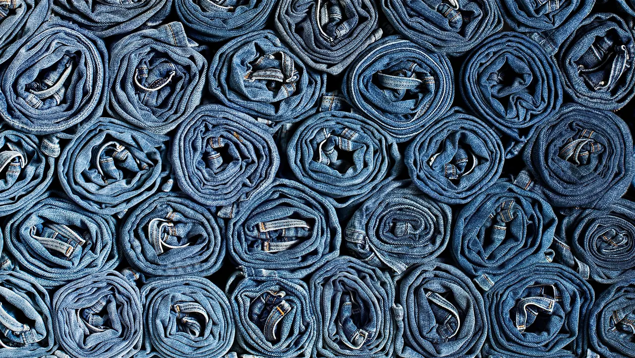 Rolled denim garments stacked together