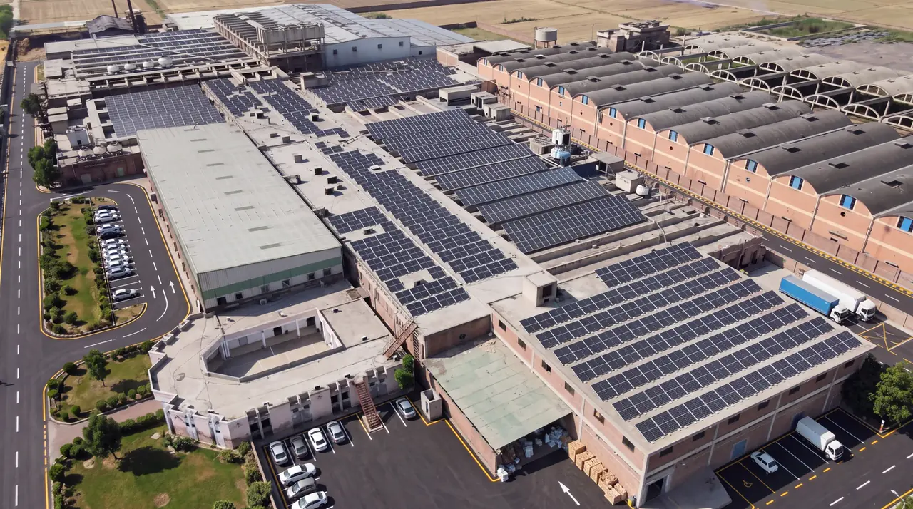 Aerial view of Rantex mill roofs covered in solar panels